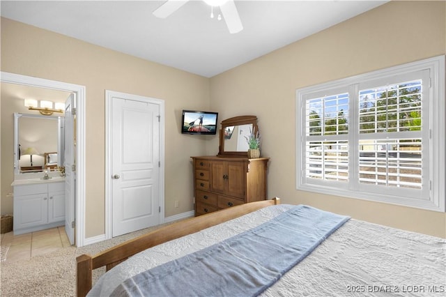 6680 Keystone Dr Unit 241, Osage Beach, MO 65065 - carpeted bedroom with ensuite bath, a ceiling fan, and tile patterned floors
