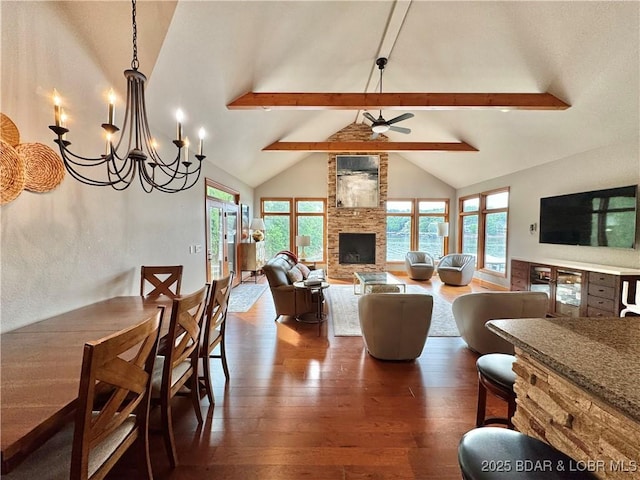 158 Oak Manor Cir, Sunrise Beach, MO 65079 - living room with beam ceiling, dark wood-type flooring, high vaulted ceiling, ceiling fan, and a chandelier