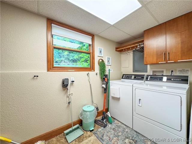 158 Oak Manor Cir, Sunrise Beach, MO 65079 - laundry area with washer and clothes dryer, cabinet space, a textured wall, and electric panel