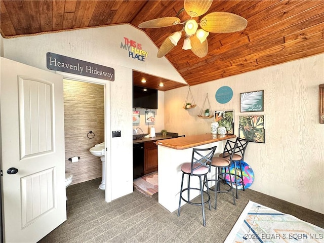 158 Oak Manor Cir, Sunrise Beach, MO 65079 - kitchen featuring wooden ceiling, lofted ceiling, a breakfast bar area, a ceiling fan, and dishwasher