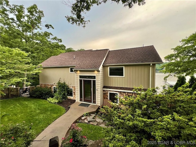 158 Oak Manor Cir, Sunrise Beach, MO 65079 - view of front of property with stone siding and roof with shingles