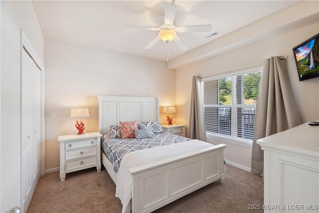 18136 Millstone Cove Rd Unit 136, Gravois Mills, MO 65037 - carpeted bedroom featuring baseboards and ceiling fan