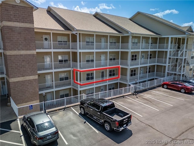 18136 Millstone Cove Rd Unit 136, Gravois Mills, MO 65037 - view of apartment building / complex with uncovered parking