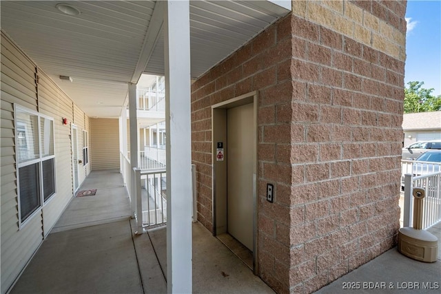 18136 Millstone Cove Rd Unit 136, Gravois Mills, MO 65037 - entrance to property featuring elevator and brick siding
