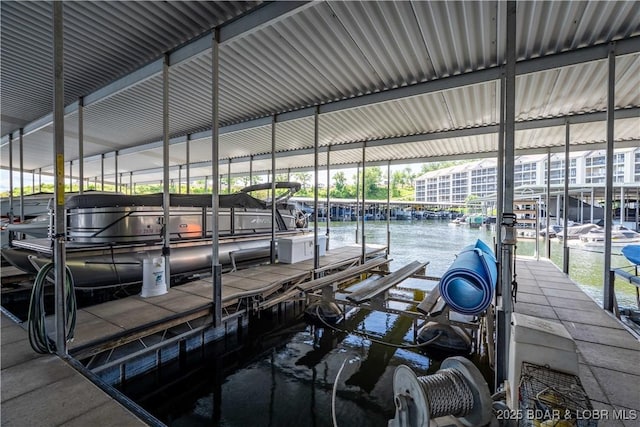 18136 Millstone Cove Rd Unit 136, Gravois Mills, MO 65037 - dock featuring boat lift and a water view
