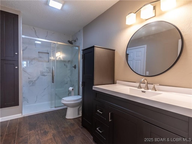 1403 Ginger Rd, Lake Ozark, MO 65049 - full bath with a marble finish shower, wood finished floors, vanity, and a textured ceiling