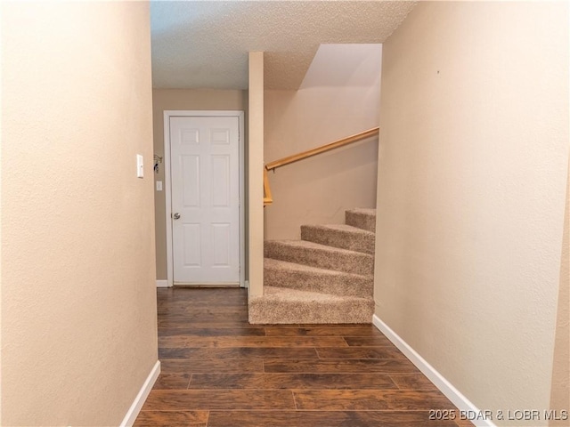 1403 Ginger Rd, Lake Ozark, MO 65049 - stairs featuring wood finished floors and a textured ceiling