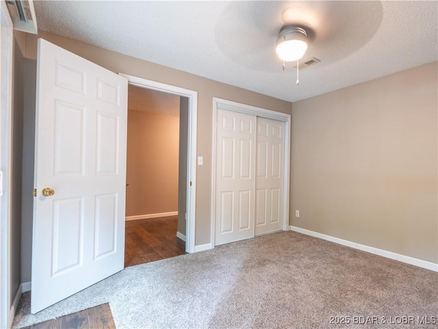 1403 Ginger Rd, Lake Ozark, MO 65049 - unfurnished bedroom with carpet, a closet, and a ceiling fan