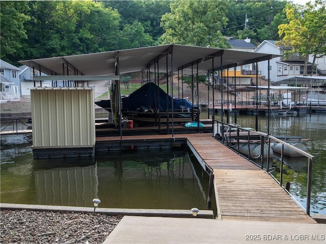 1403 Ginger Rd, Lake Ozark, MO 65049 - dock area featuring a water view, boat lift, and a forest view