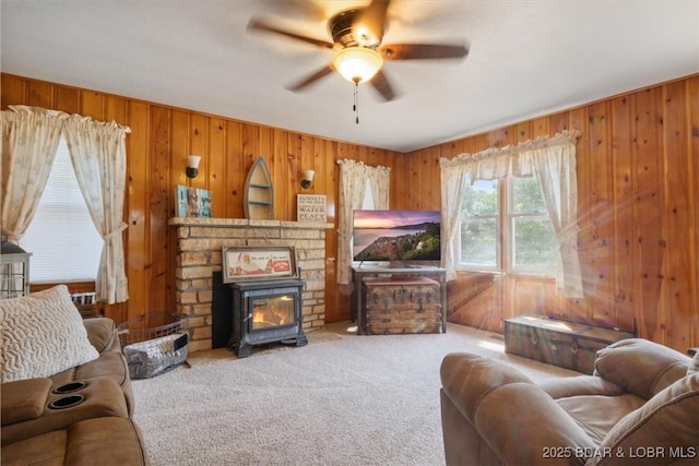 33682 Daybreak Rd, Gravois Mills, MO 65037 - living area featuring ceiling fan, wood walls, carpet, and a glass covered fireplace