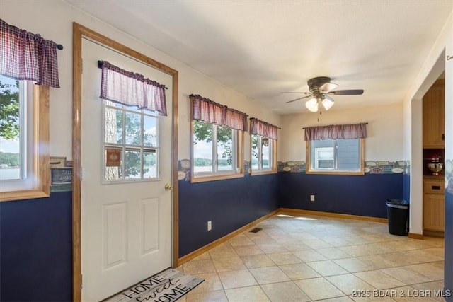 33682 Daybreak Rd, Gravois Mills, MO 65037 - doorway with ceiling fan and light tile patterned floors