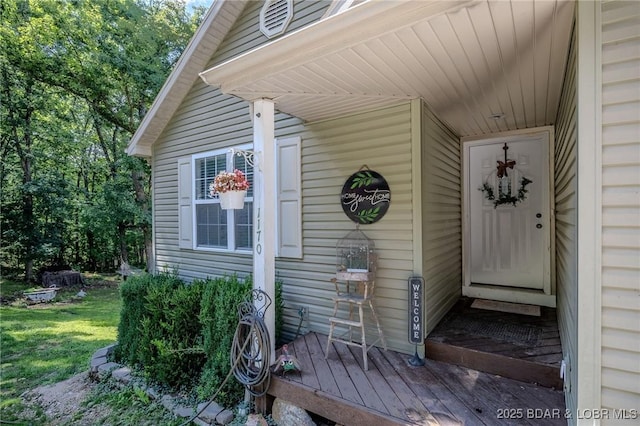 1170 San Jose Dr, Osage Beach, MO 65065 - view of exterior entry with a lawn