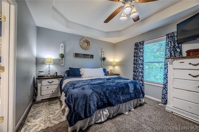 1170 San Jose Dr, Osage Beach, MO 65065 - bedroom featuring carpet, a tray ceiling, and a ceiling fan