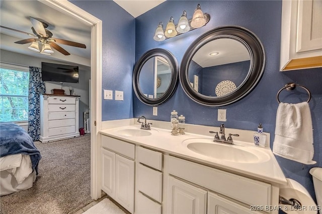 1170 San Jose Dr, Osage Beach, MO 65065 - ensuite bathroom featuring double vanity and a ceiling fan