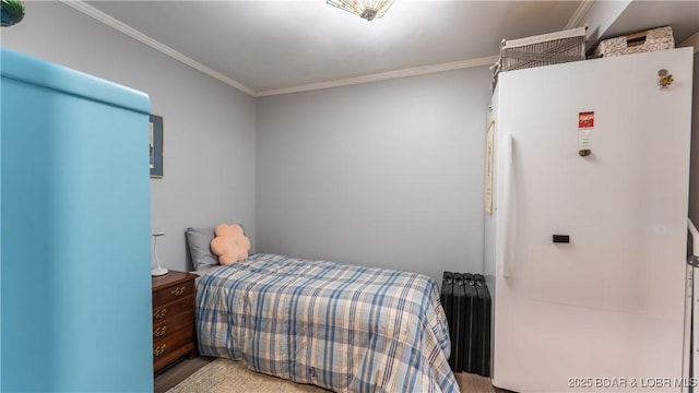 168 Moeller Way, Camdenton, MO 65020 - bedroom featuring freestanding refrigerator, crown molding, and wood finished floors