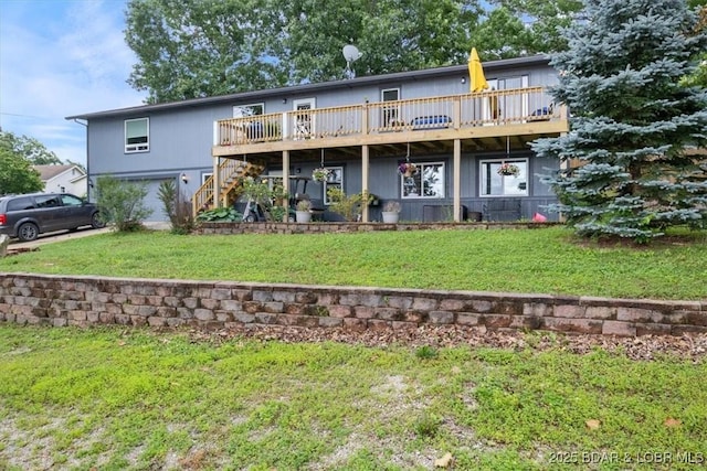 250 De Young Dr, Climax Springs, MO 65324 - rear view of house with stairway, a deck, a lawn, and an attached garage