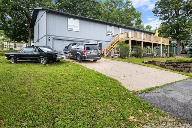 250 De Young Dr, Climax Springs, MO 65324 - view of front of property with stairway, a front lawn, a garage, a deck, and driveway