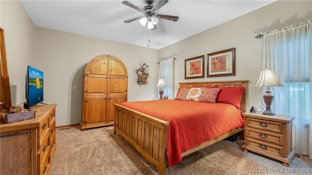 146 Palmer Dr, Lake Ozark, MO 65049 - bedroom with light carpet, ceiling fan, and arched walkways