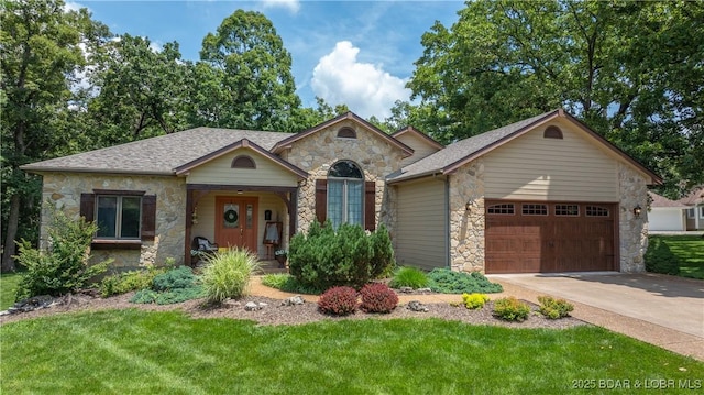 146 Palmer Dr, Lake Ozark, MO 65049 - view of front of home with stone siding, an attached garage, concrete driveway, and a front yard