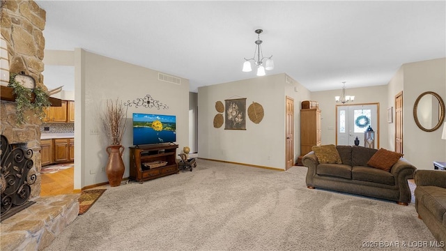 146 Palmer Dr, Lake Ozark, MO 65049 - living area featuring a chandelier and light colored carpet