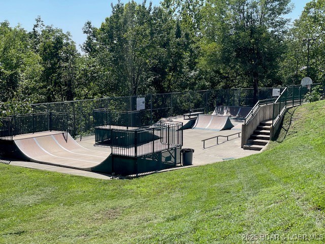 146 Palmer Dr, Lake Ozark, MO 65049 - view of home's community with view of wooded area