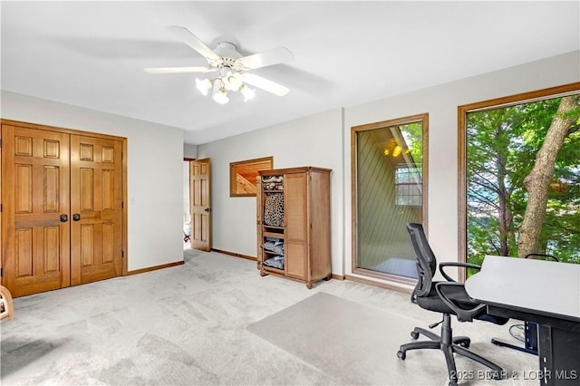 1759 Chimney Pt, Sunrise Beach, MO 65079 - home office featuring light colored carpet and a ceiling fan