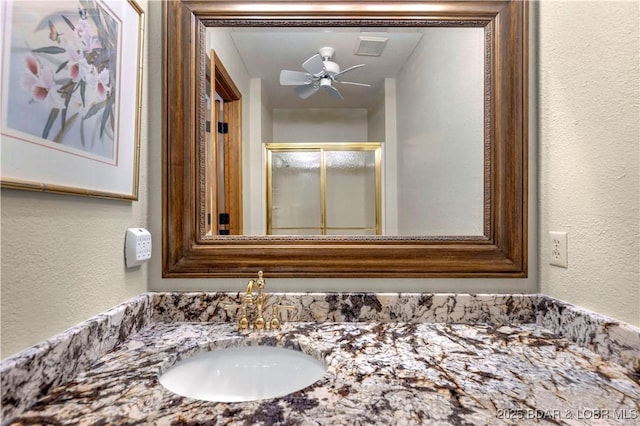 1759 Chimney Pt, Sunrise Beach, MO 65079 - full bath featuring a textured wall, a stall shower, and vanity
