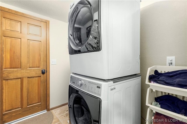 1759 Chimney Pt, Sunrise Beach, MO 65079 - washroom featuring estacked washer and dryer and light tile patterned flooring