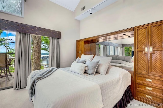 1759 Chimney Pt, Sunrise Beach, MO 65079 - carpeted bedroom with access to outside, a towering ceiling, and ornamental molding