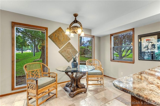 1759 Chimney Pt, Sunrise Beach, MO 65079 - dining space with plenty of natural light and light stone finish floors