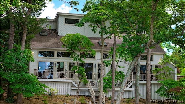 1759 Chimney Pt, Sunrise Beach, MO 65079 - rear view of property with stairs and a shingled roof