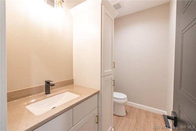 370 Via Appia Dr, Sunrise Beach, MO 65079 - bathroom featuring wood finished floors and vanity