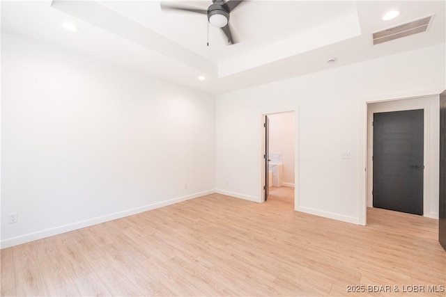 370 Via Appia Dr, Sunrise Beach, MO 65079 - spare room featuring a tray ceiling, recessed lighting, light wood finished floors, and ceiling fan