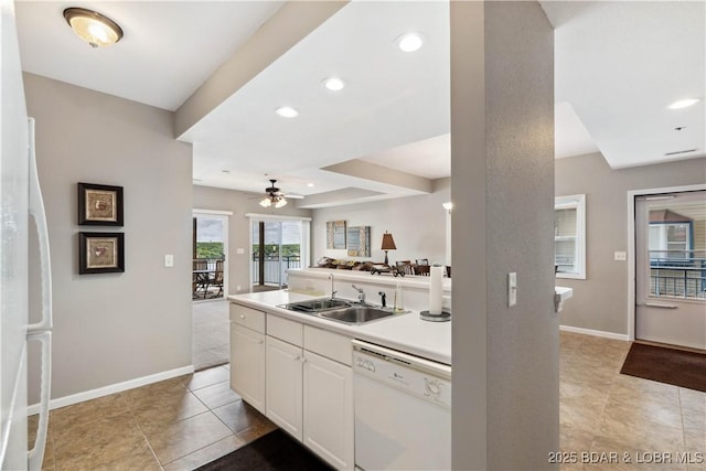72 Palisades Lake View Dr Unit 2B, Lake Ozark, MO 65049 - kitchen featuring white appliances, a ceiling fan, open floor plan, a peninsula, and light tile patterned flooring