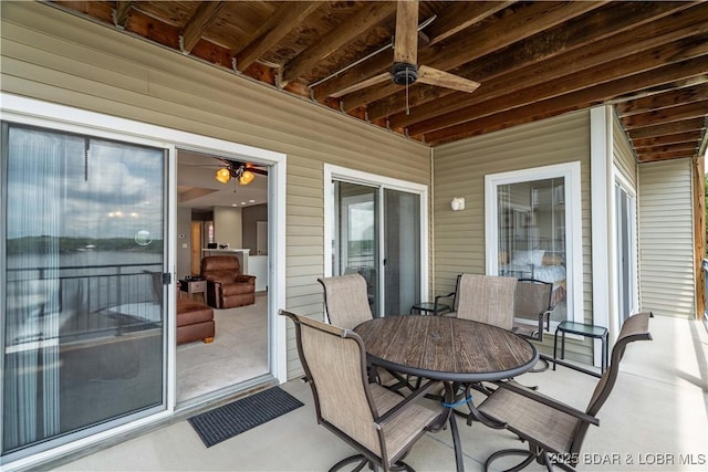 72 Palisades Lake View Dr Unit 2B, Lake Ozark, MO 65049 - view of patio / terrace with a ceiling fan and outdoor dining area