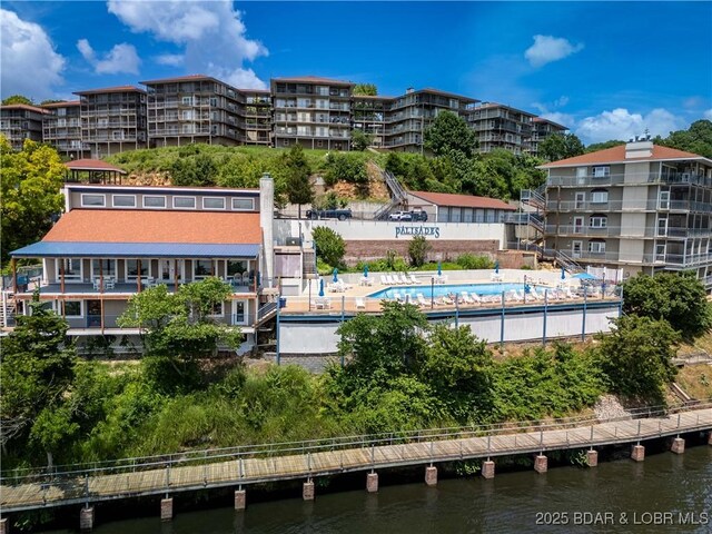 72 Palisades Lake View Dr Unit 2B, Lake Ozark, MO 65049 - view of apartment building / complex with a water view and a community pool