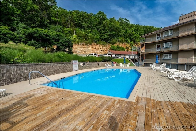 72 Palisades Lake View Dr Unit 2B, Lake Ozark, MO 65049 - community pool featuring a wooden deck
