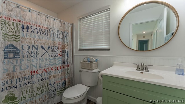 150 Trigger Rd, Linn Creek, MO 65052 - full bathroom featuring vanity, a wainscoted wall, and curtained shower