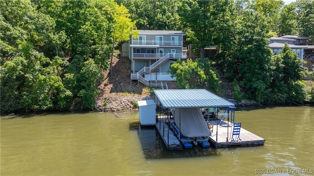 150 Trigger Rd, Linn Creek, MO 65052 - dock area featuring boat lift, a water view, and stairs