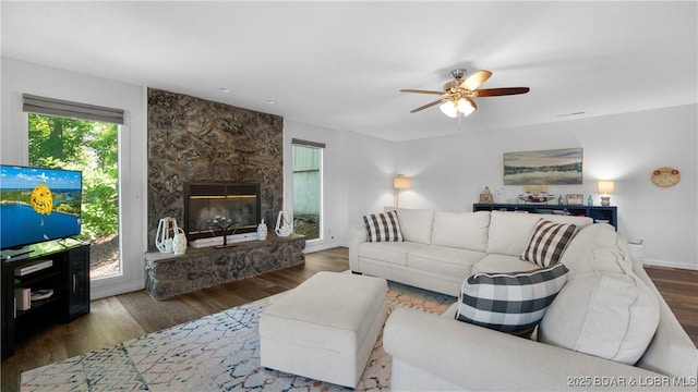 150 Trigger Rd, Linn Creek, MO 65052 - living room featuring ceiling fan, wood finished floors, and a fireplace