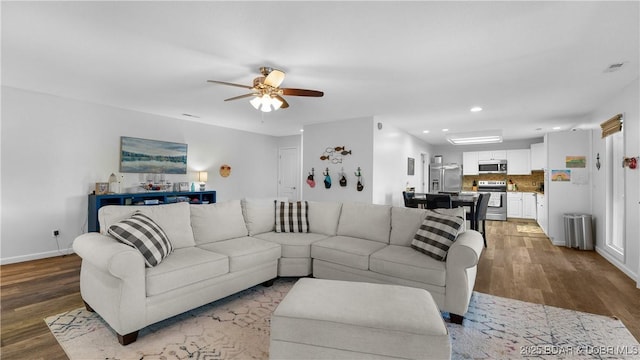 150 Trigger Rd, Linn Creek, MO 65052 - living room with wood finished floors, ceiling fan, and recessed lighting