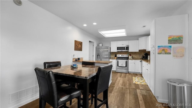 150 Trigger Rd, Linn Creek, MO 65052 - dining room with dark wood finished floors and recessed lighting