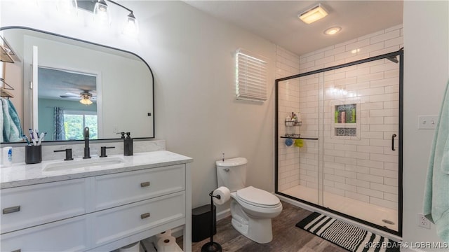 150 Trigger Rd, Linn Creek, MO 65052 - full bath featuring vanity, a stall shower, wood finished floors, and ceiling fan