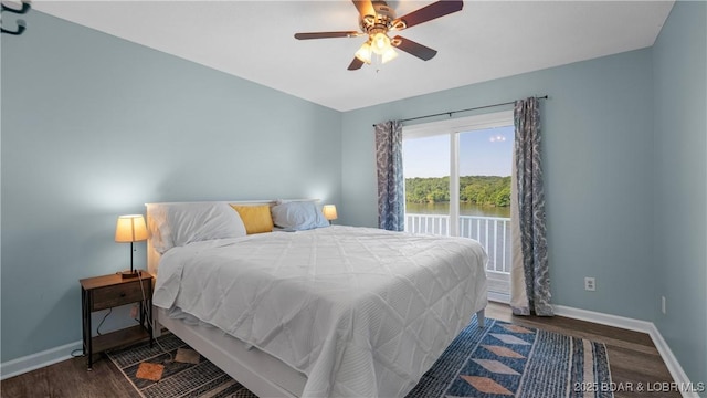150 Trigger Rd, Linn Creek, MO 65052 - bedroom with wood finished floors, a ceiling fan, and a water view