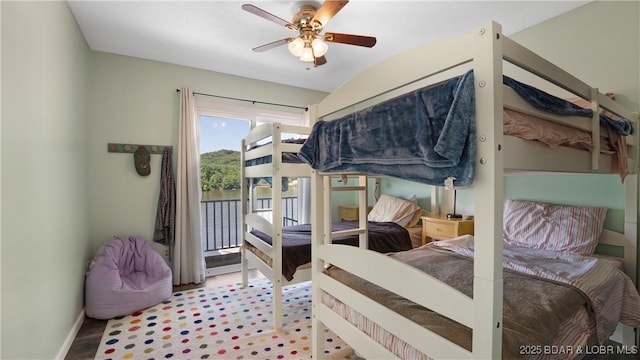 150 Trigger Rd, Linn Creek, MO 65052 - bedroom with access to exterior and ceiling fan