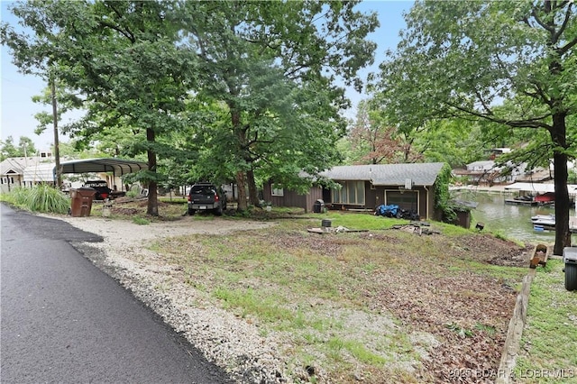 333 Crane Cove Rd, Sunrise Beach, MO 65079 - view of front of property with a carport and driveway