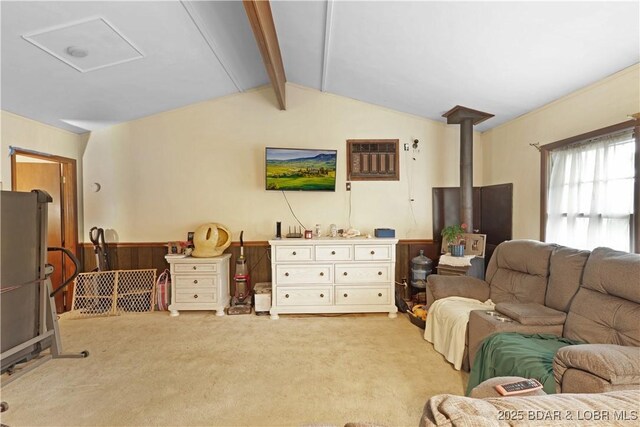 333 Crane Cove Rd, Sunrise Beach, MO 65079 - living area featuring light colored carpet, a wood stove, and a wall unit AC