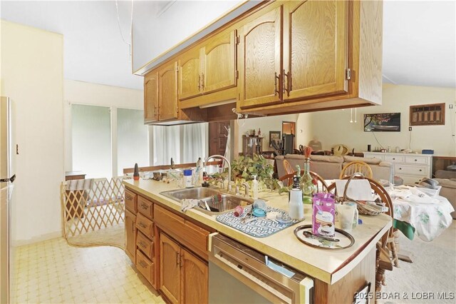 333 Crane Cove Rd, Sunrise Beach, MO 65079 - kitchen featuring stainless steel dishwasher, light countertops, open floor plan, and freestanding refrigerator