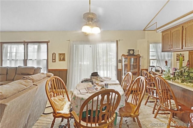 333 Crane Cove Rd, Sunrise Beach, MO 65079 - dining room with wainscoting, ceiling fan, and wooden walls