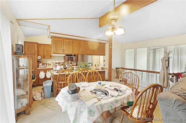 333 Crane Cove Rd, Sunrise Beach, MO 65079 - dining area featuring lofted ceiling and light carpet